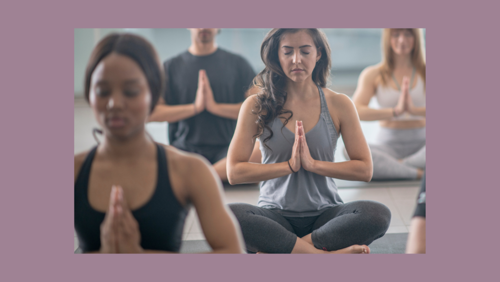 yoga class sits in rows