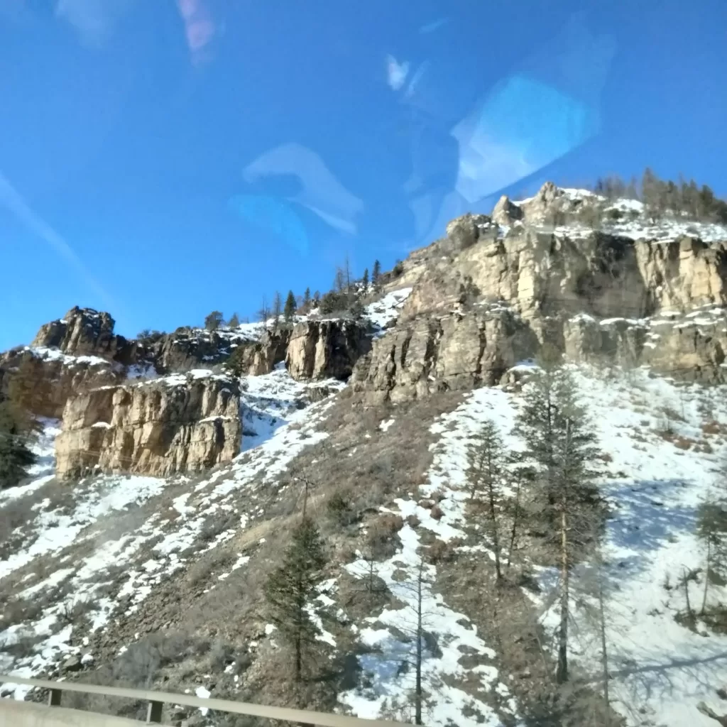 snowy ridge beside freeway near vail