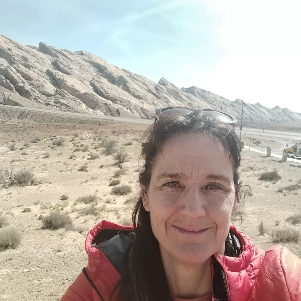 smiling next to utah rocks