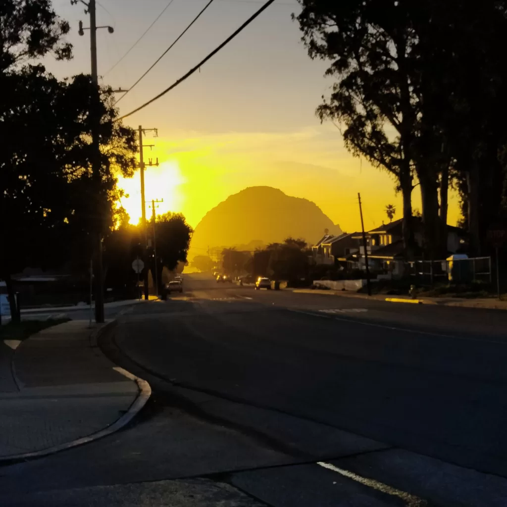 morro rock from town at sunset