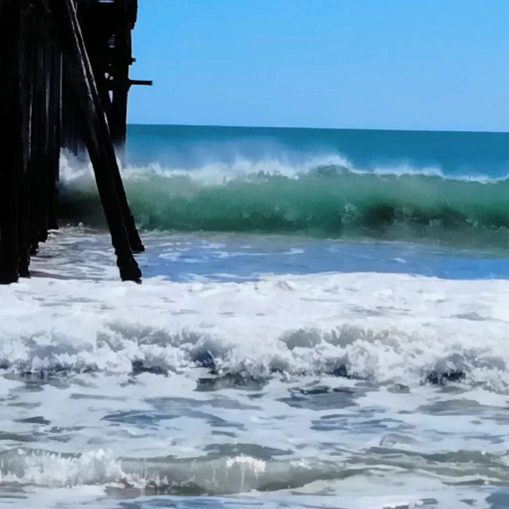 waves on pier san simeon state beach