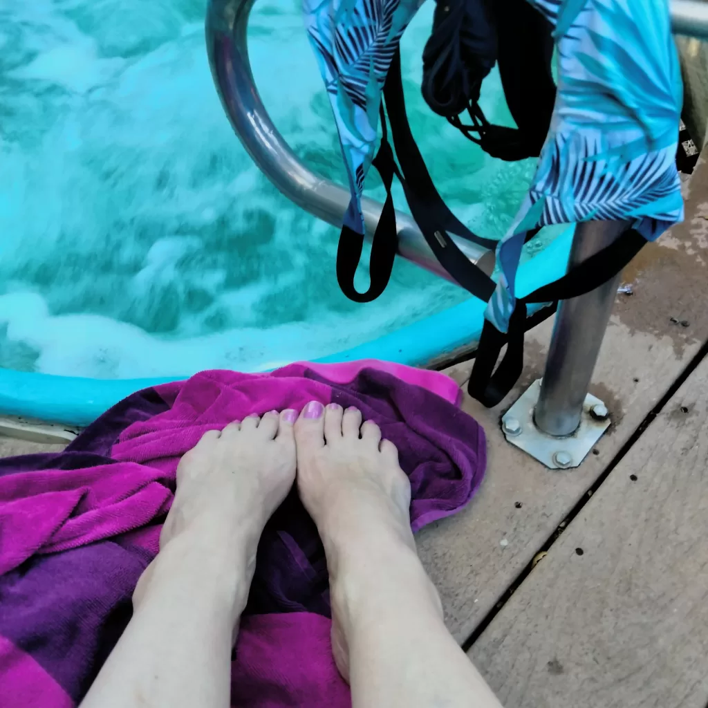 feet alongside hot tub avila springs