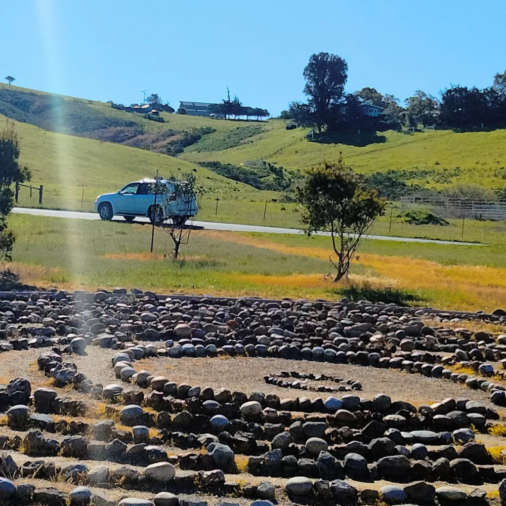 the labyrinth, car, and hillside
