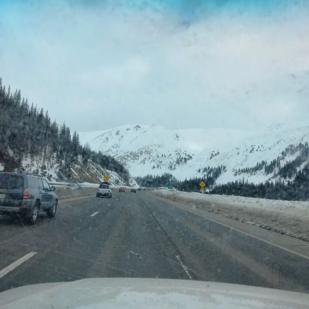 crossing vail pass in spring snow storm